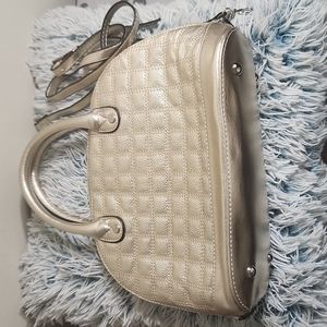 Tignanello hand bag , gold  color